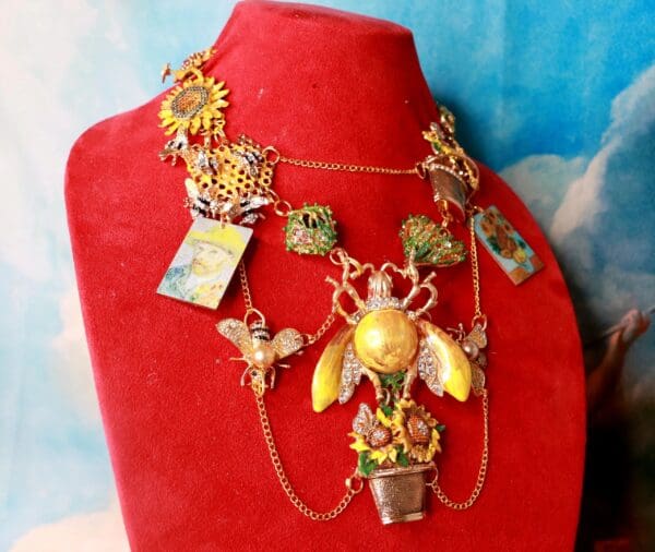A red necklace with many different items on it