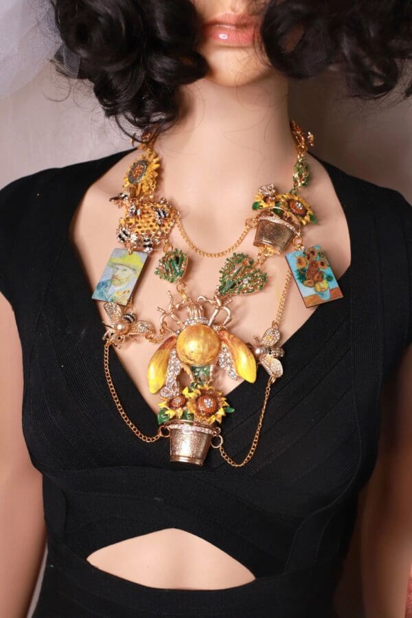 A woman wearing a necklace with many different items.