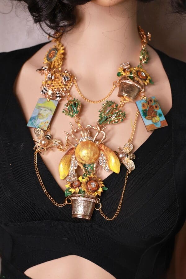 A woman wearing a necklace with many different items.