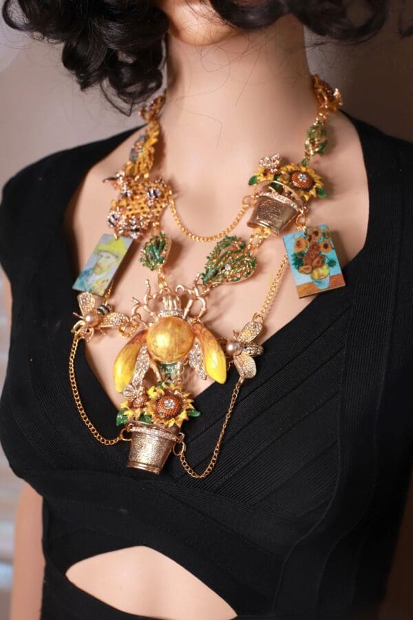 A woman wearing a necklace with many different items.