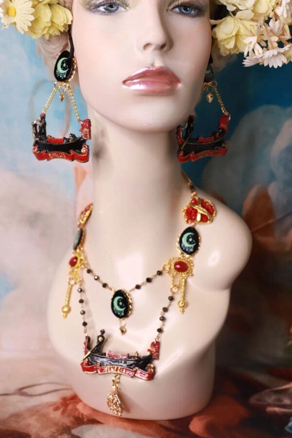 A mannequin wearing jewelry and earrings.