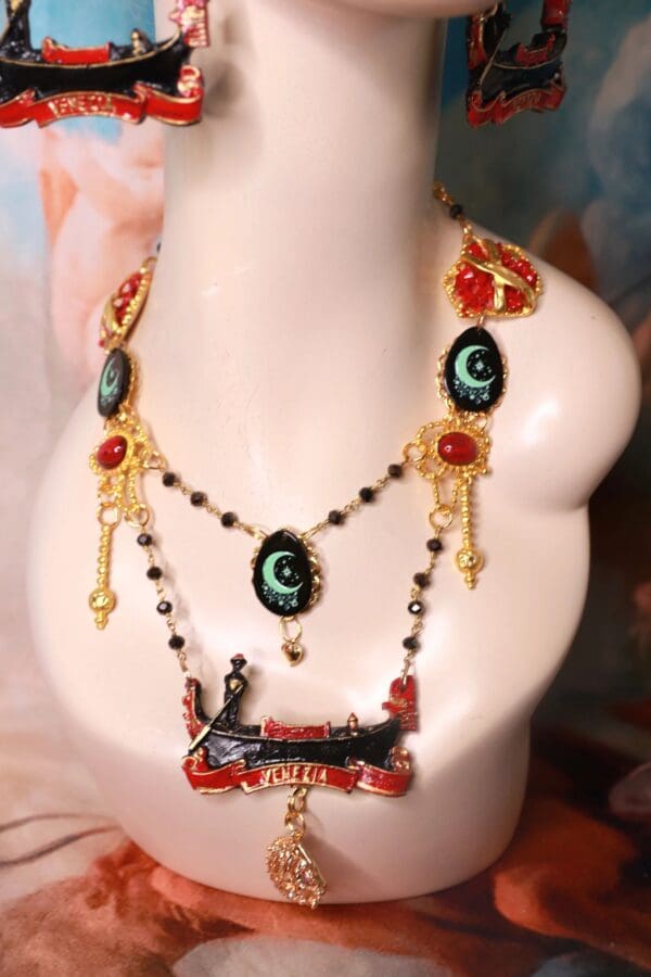 A necklace with a picture of a woman and two necklaces.