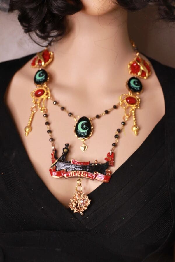 A woman wearing a necklace with a train on it.