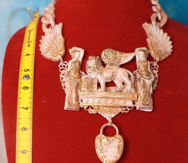 A necklace with an elephant and other animals on it.
