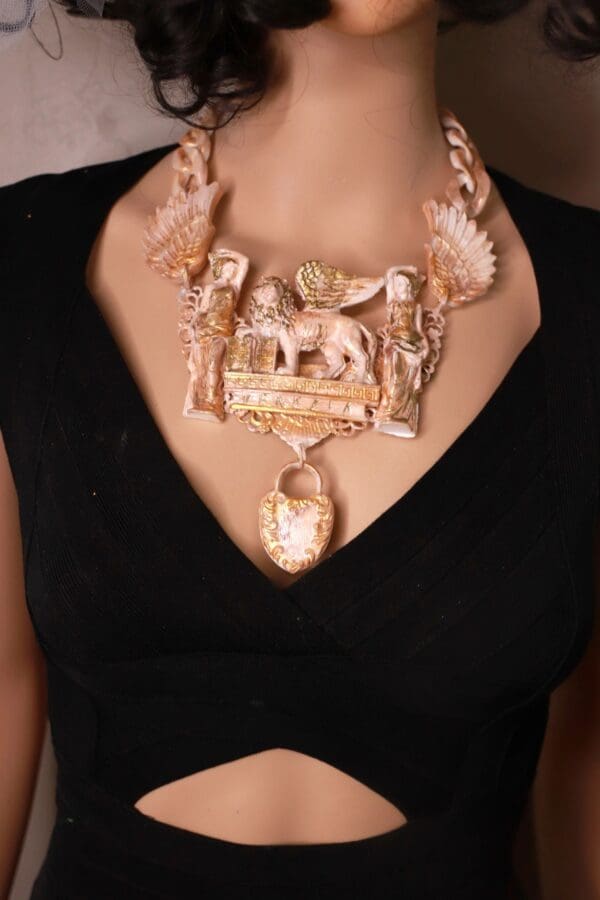 A woman wearing a necklace with an elephant and other animals.