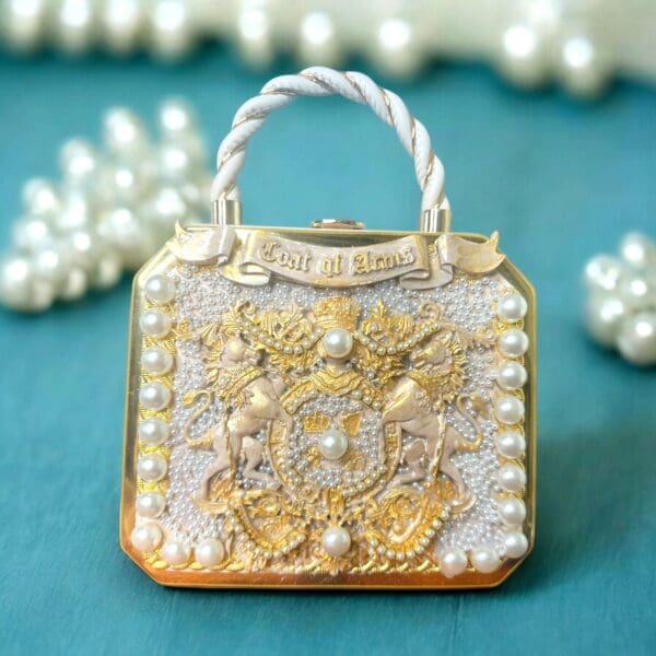 A purse with pearls and gold on it