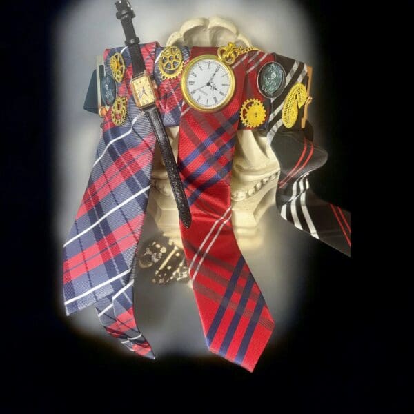 A clock and some ties are hanging on the wall.