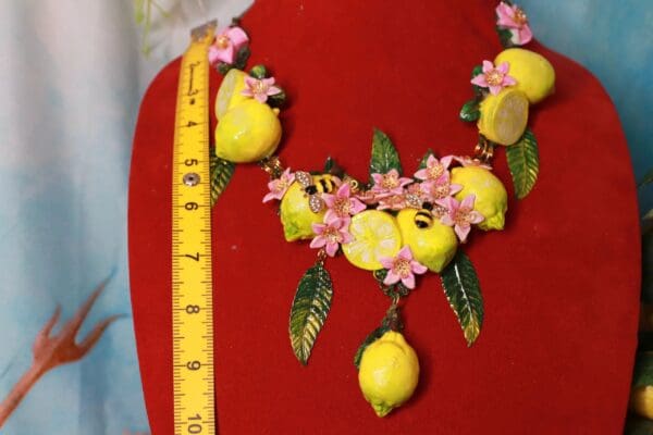 A red chair with lemons and flowers on it