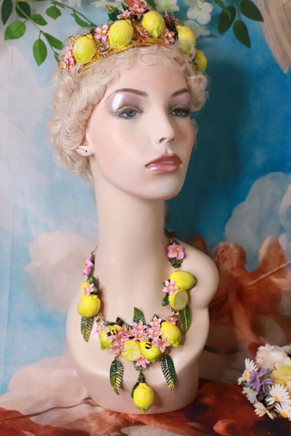 A mannequin wearing a necklace with yellow flowers.