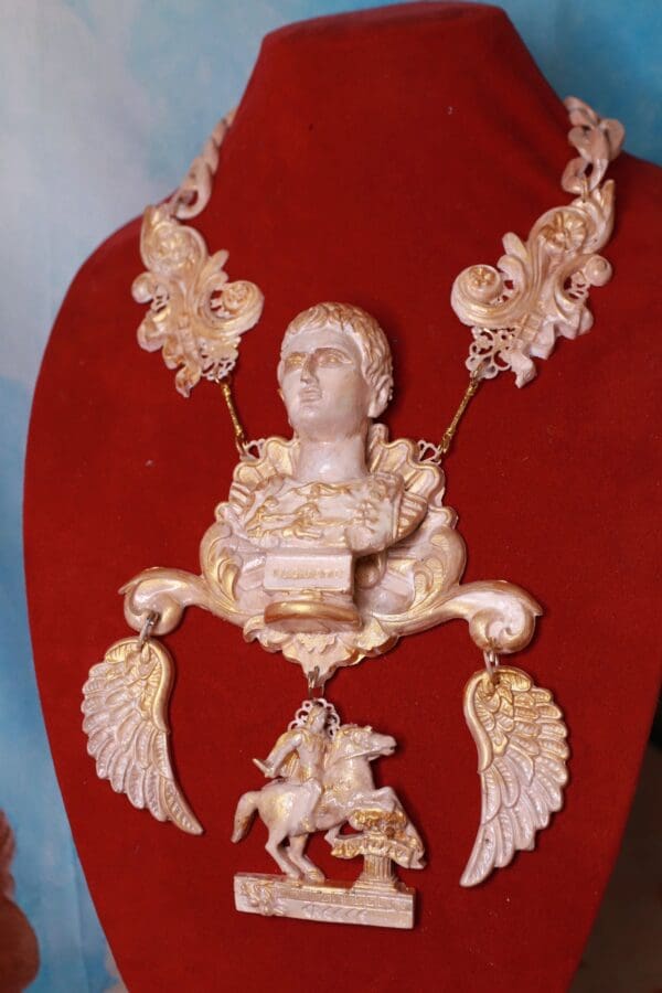 A red chair with some gold decorations on it