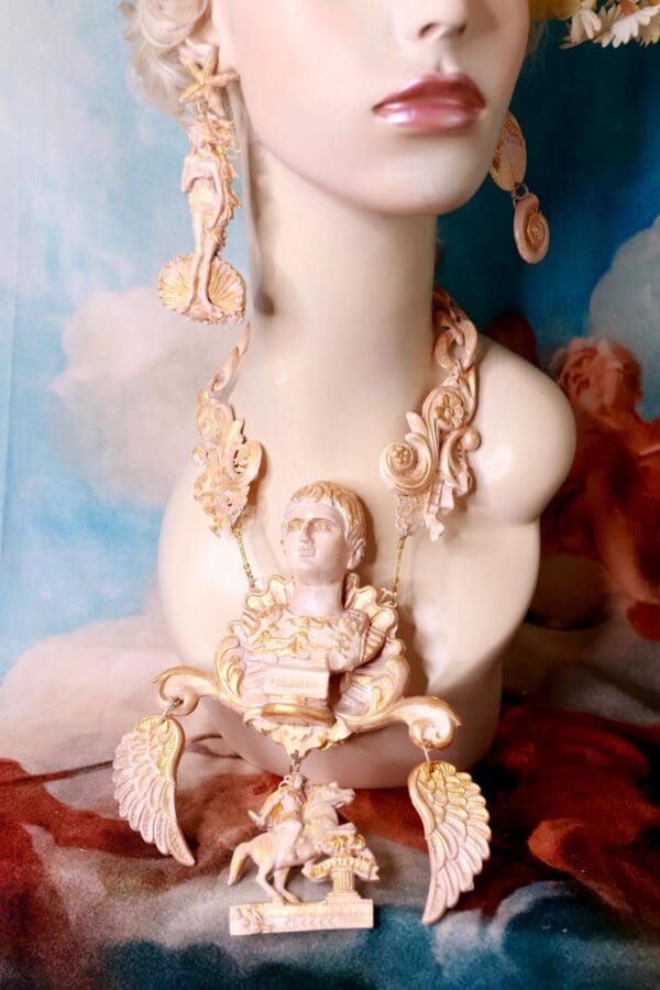 A statue of a woman with jewelry on her neck.