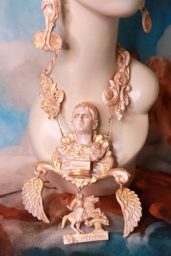 A statue of a man sitting in the middle of a body.