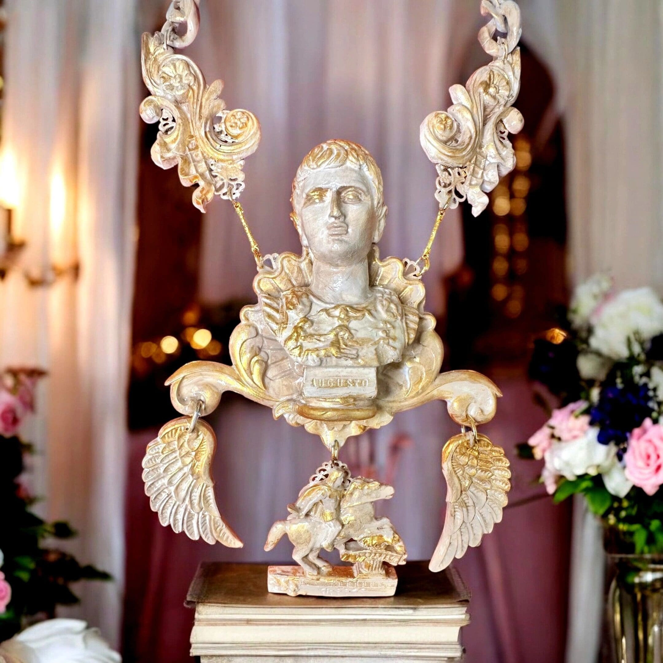 A statue of a man with wings and a bird on it.