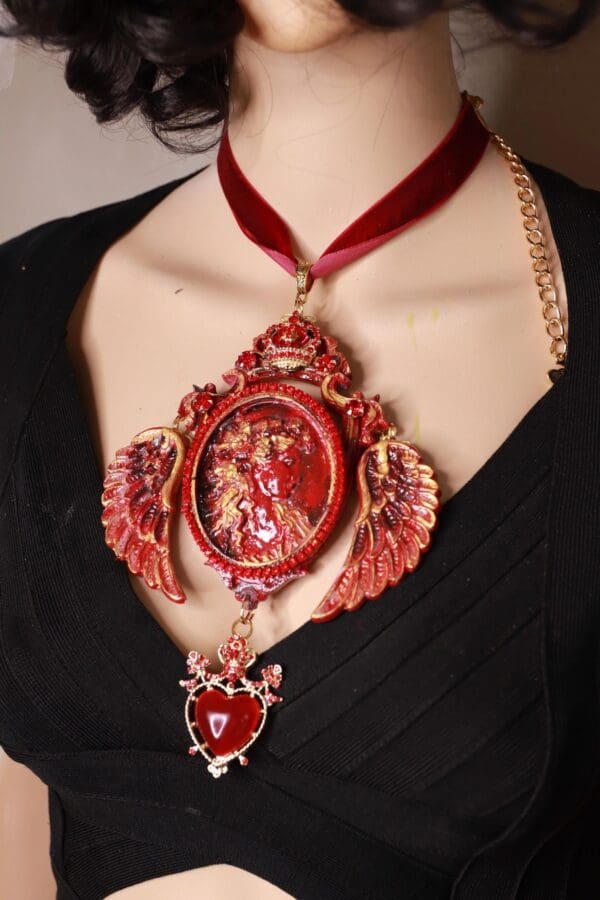 A woman wearing a red necklace with a clock on it.