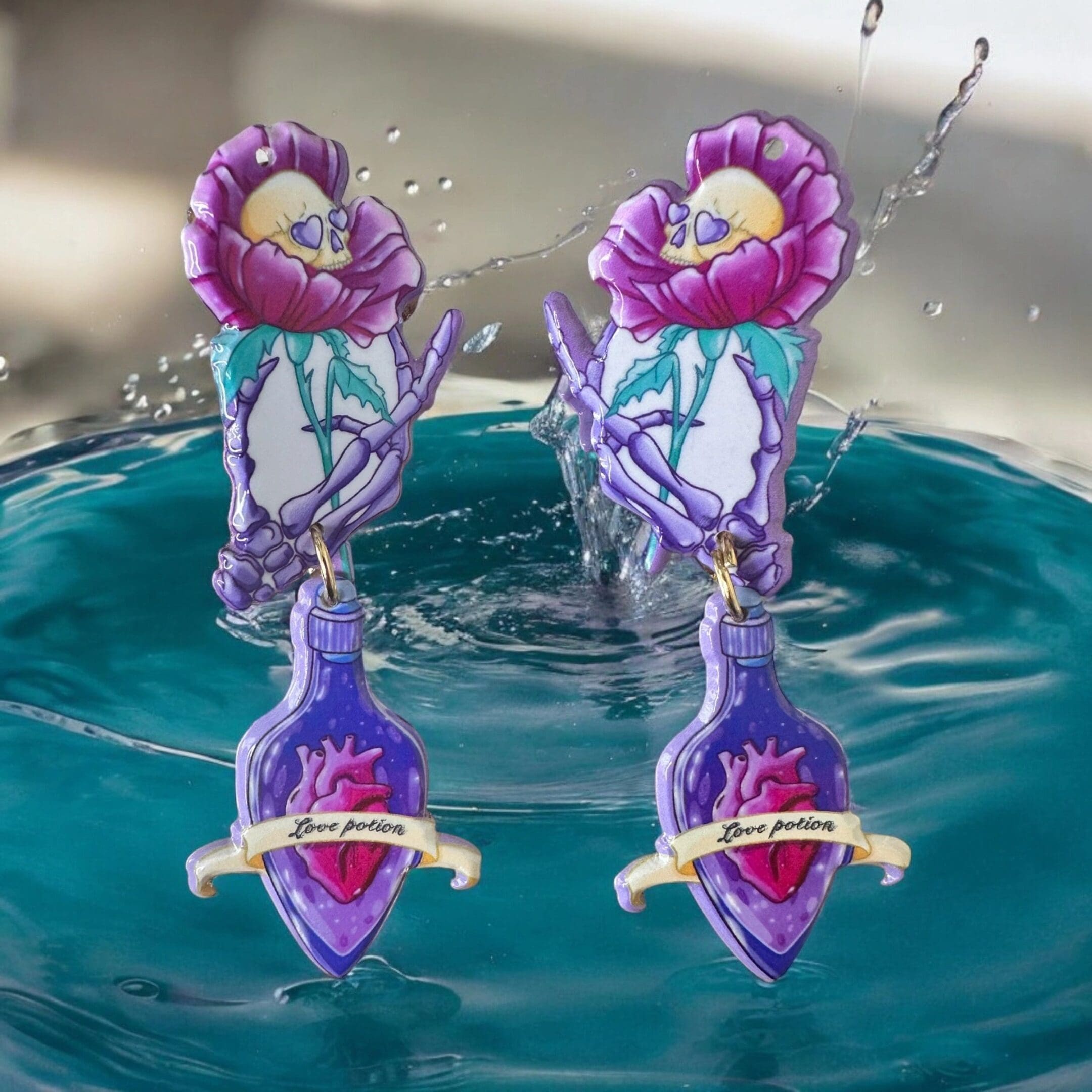 Two purple and pink balloons floating in a pool of water.