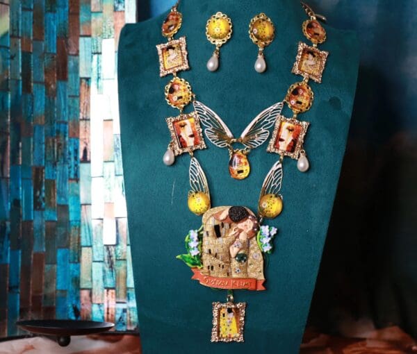 A display of jewelry on top of a wooden stand.