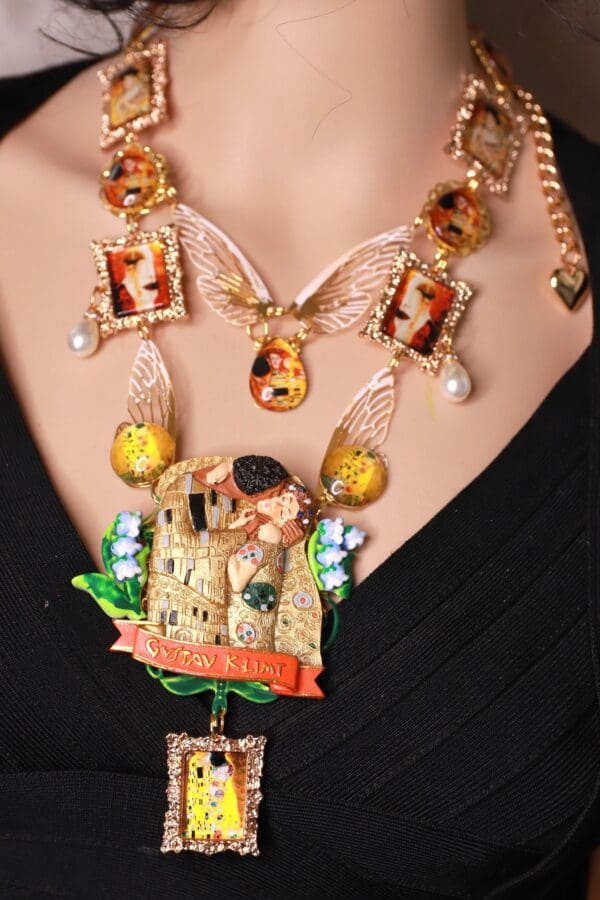 A woman wearing a necklace with a castle on it.