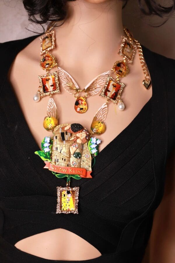 A woman wearing a necklace with many different pictures.