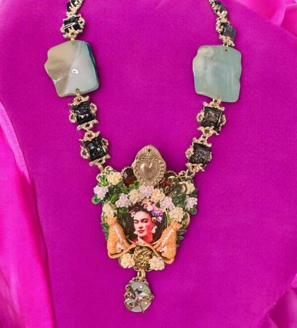 A necklace with a picture of a woman on it.