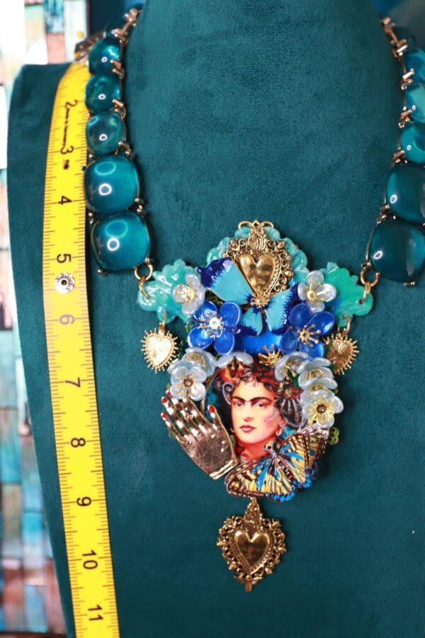 A necklace with a woman 's face on it.