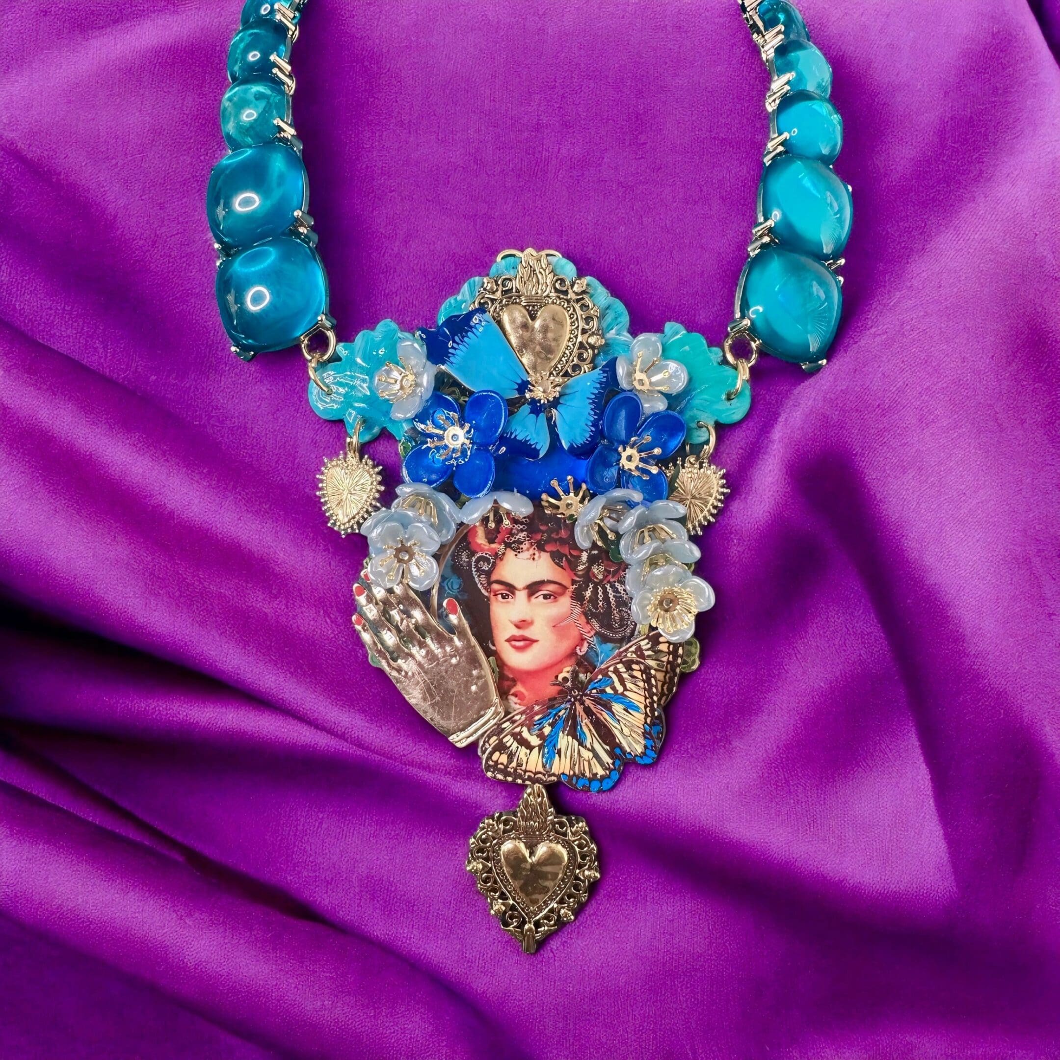 A necklace with a picture of frida kahlo on it.
