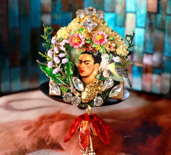 A painting of frida kahlo with flowers and a red flower.