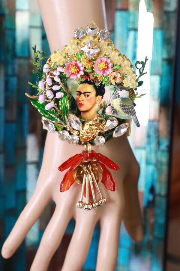 A hand with a wreath of flowers and a woman 's face on it.