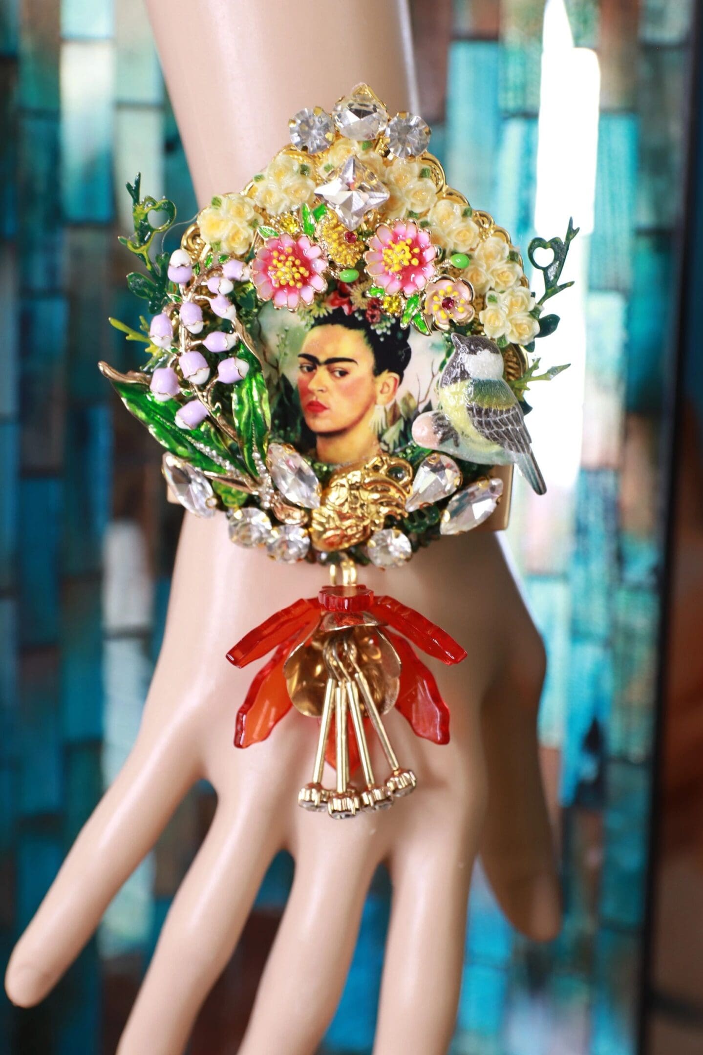 A hand with a wreath of flowers and a woman 's face on it.