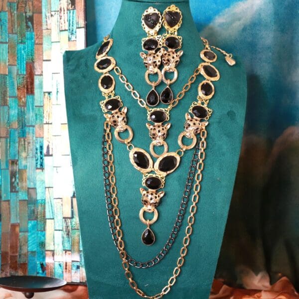 A necklace and earrings set on display in a jewelry store.
