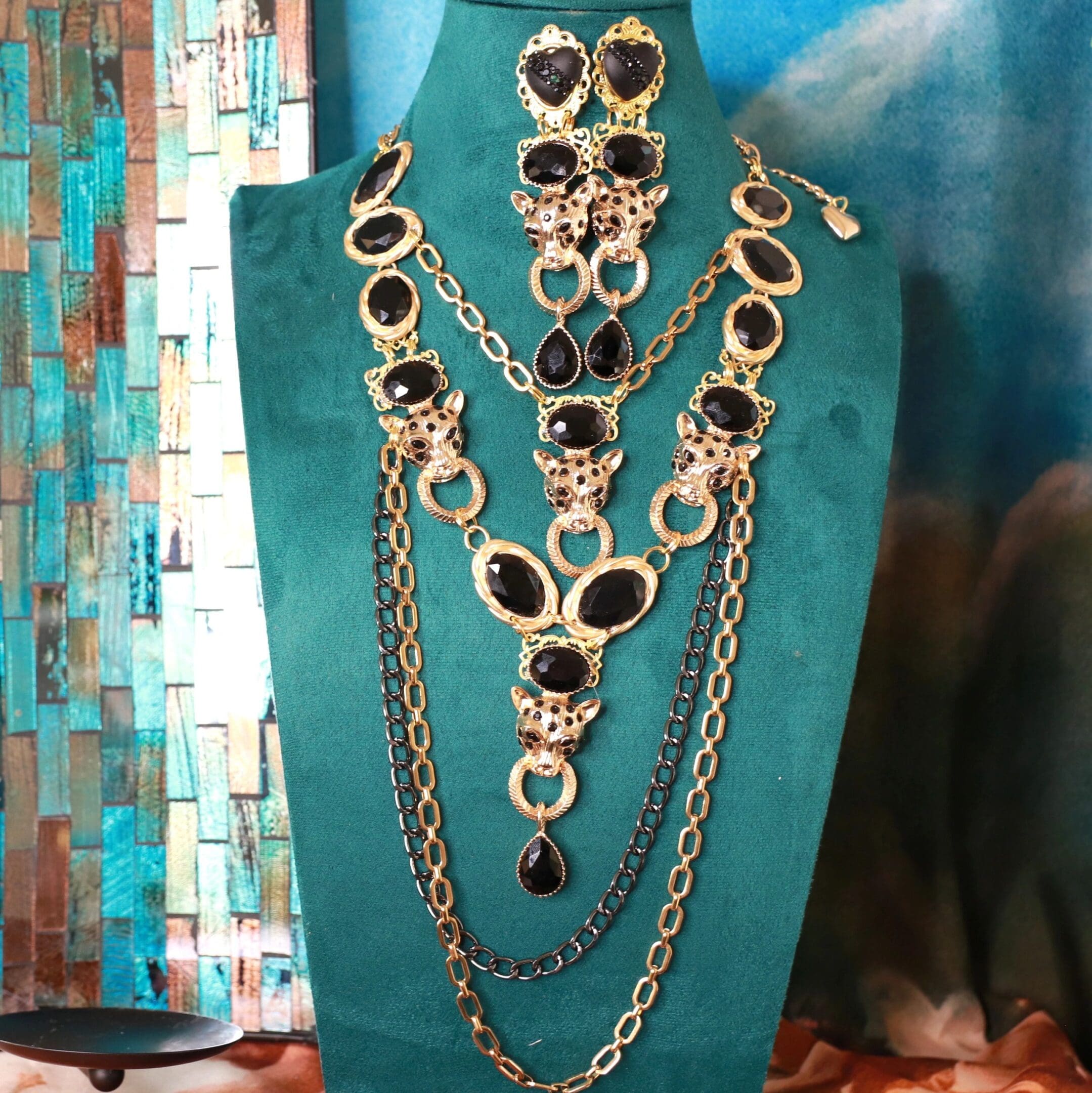 A necklace and earrings set on display in a jewelry store.