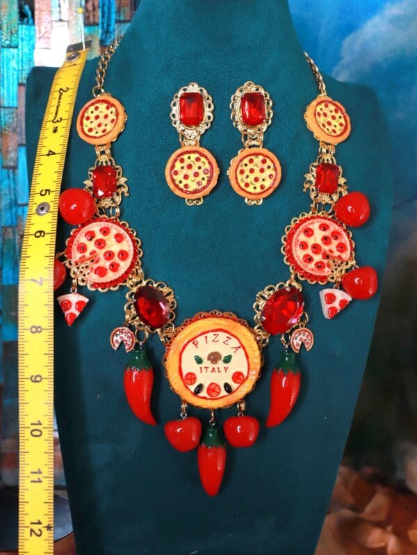 A necklace and earrings set with pepperoni pizza.