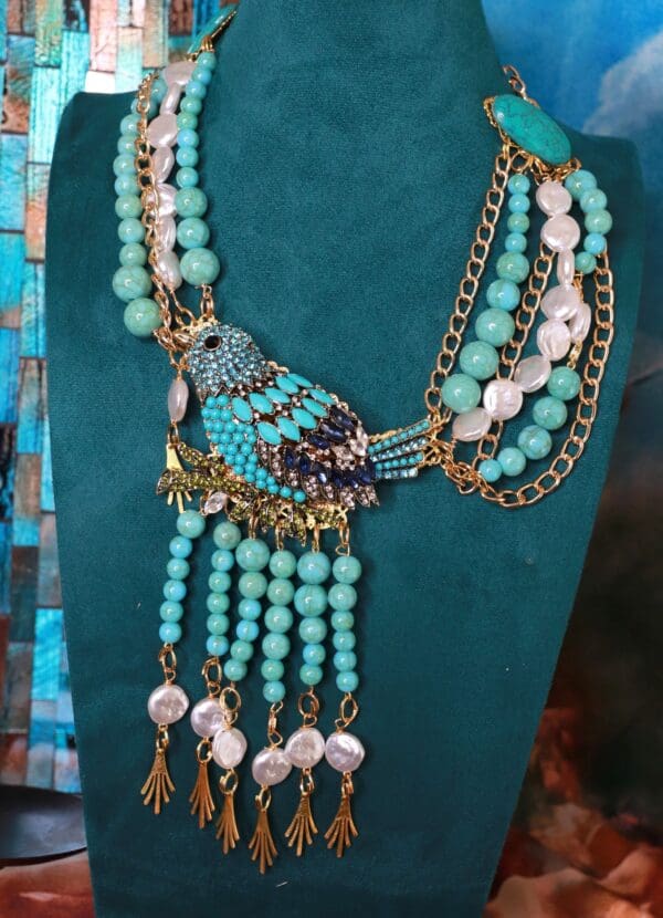 A necklace with beads and chains on display.