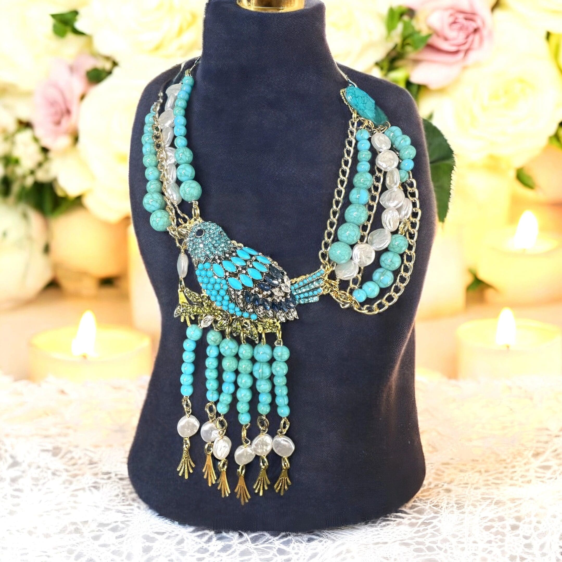 A necklace is displayed on a black stand.