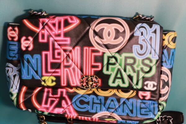 A bag with neon letters on it