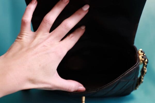 A hand is reaching for something in the air.