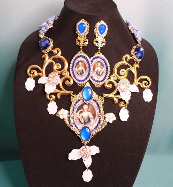 A necklace and earrings set with blue stones.