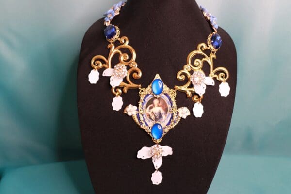 A necklace with a picture of a woman on it.