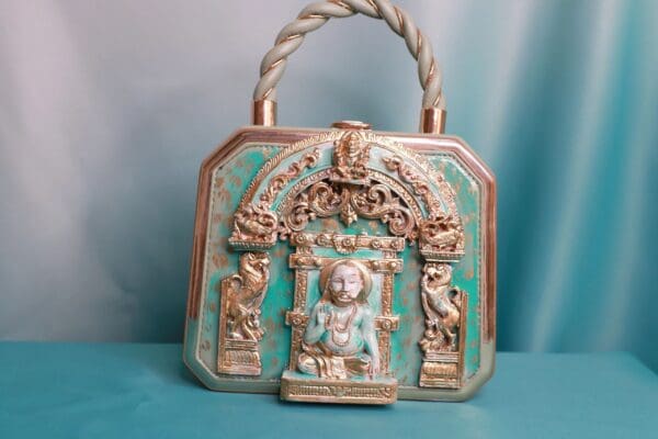 A bag with a statue of a person in it