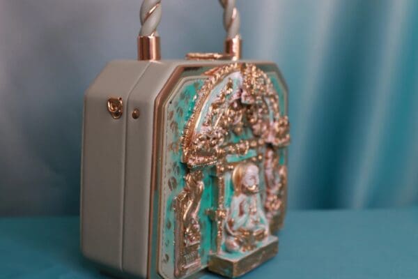 A purse that is sitting on the ground.