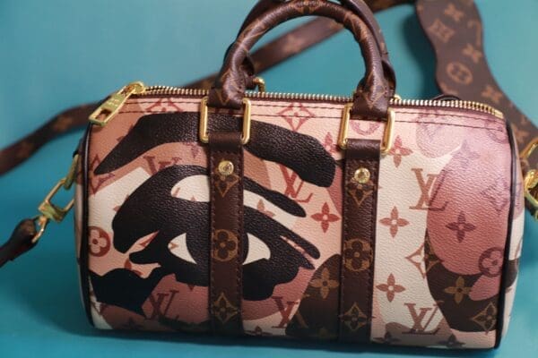 A purse with a brown and black design on it