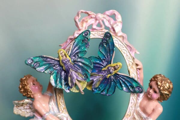 A pair of blue and purple butterfly earrings.