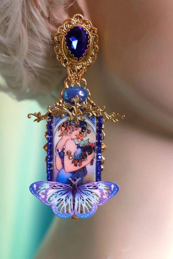 A woman wearing a blue butterfly necklace.
