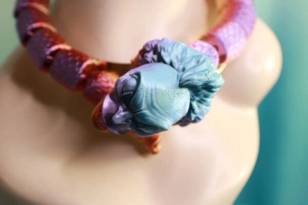 A close up of the neck of a woman wearing a necklace