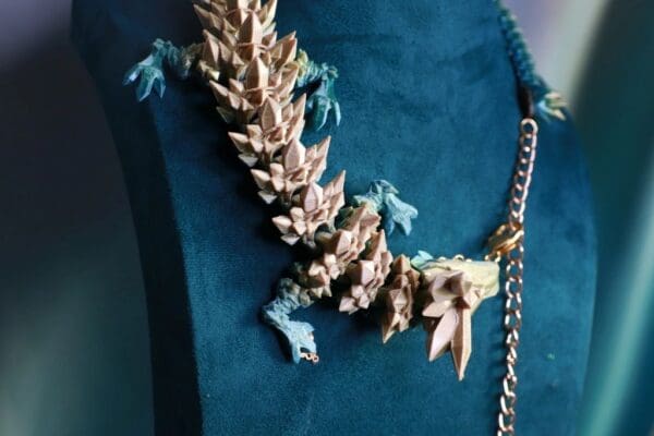 A necklace made of gold leaves and chain.
