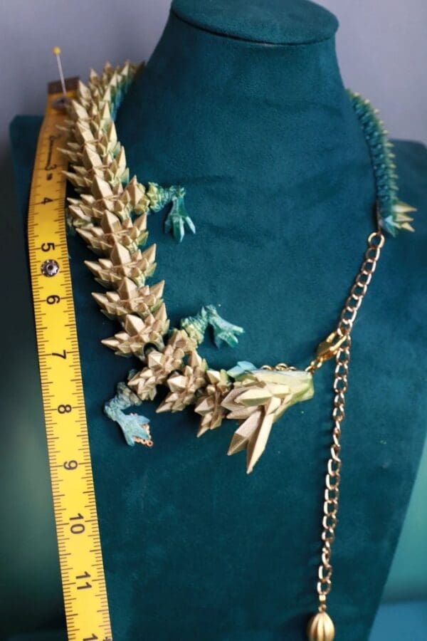 A necklace that is made to look like an iguana.