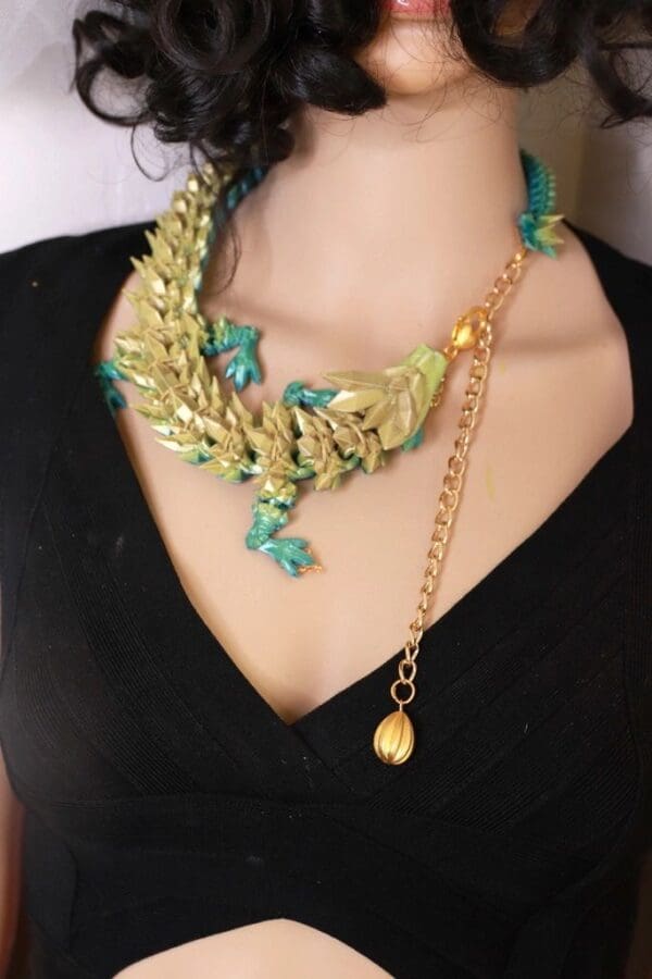 A woman wearing a necklace with green leaves.