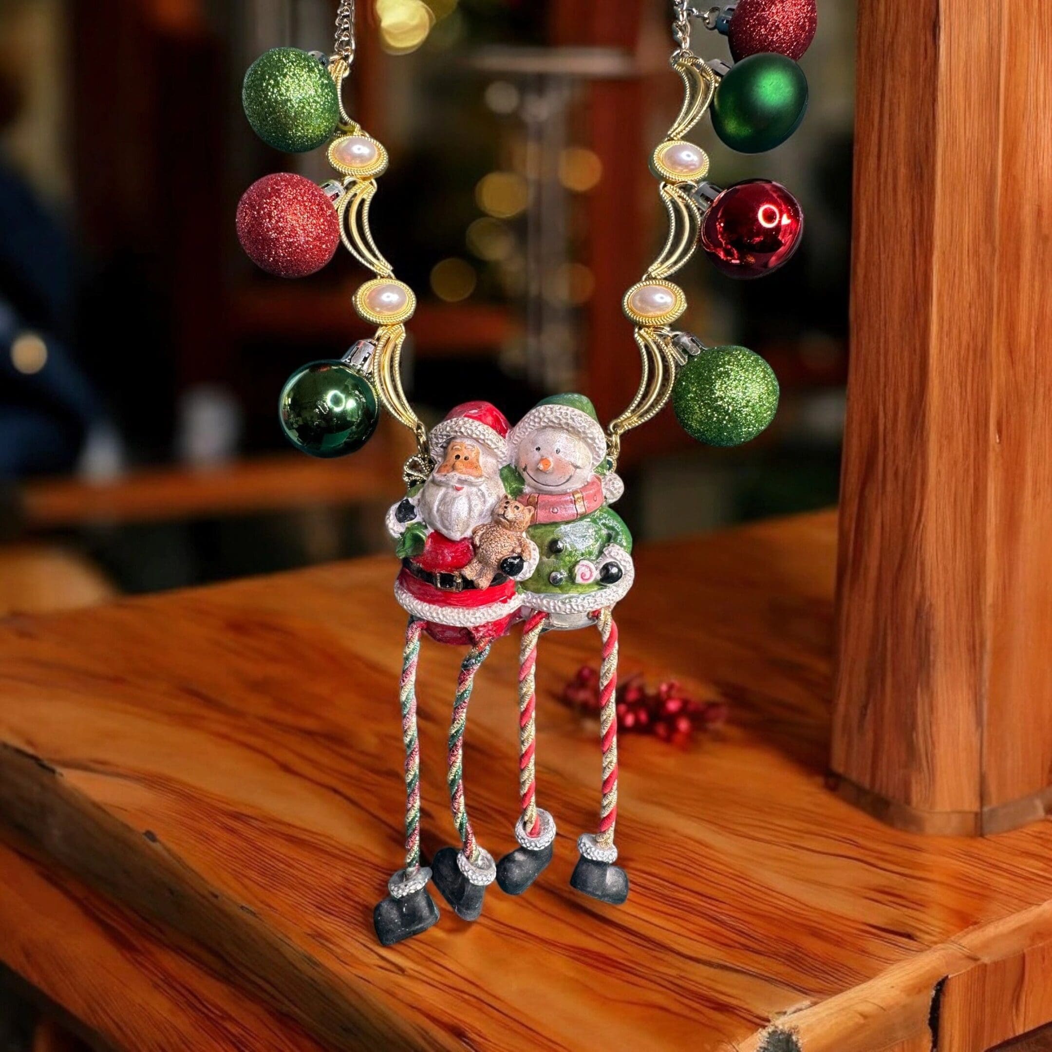 A wooden table with two small figurines on it