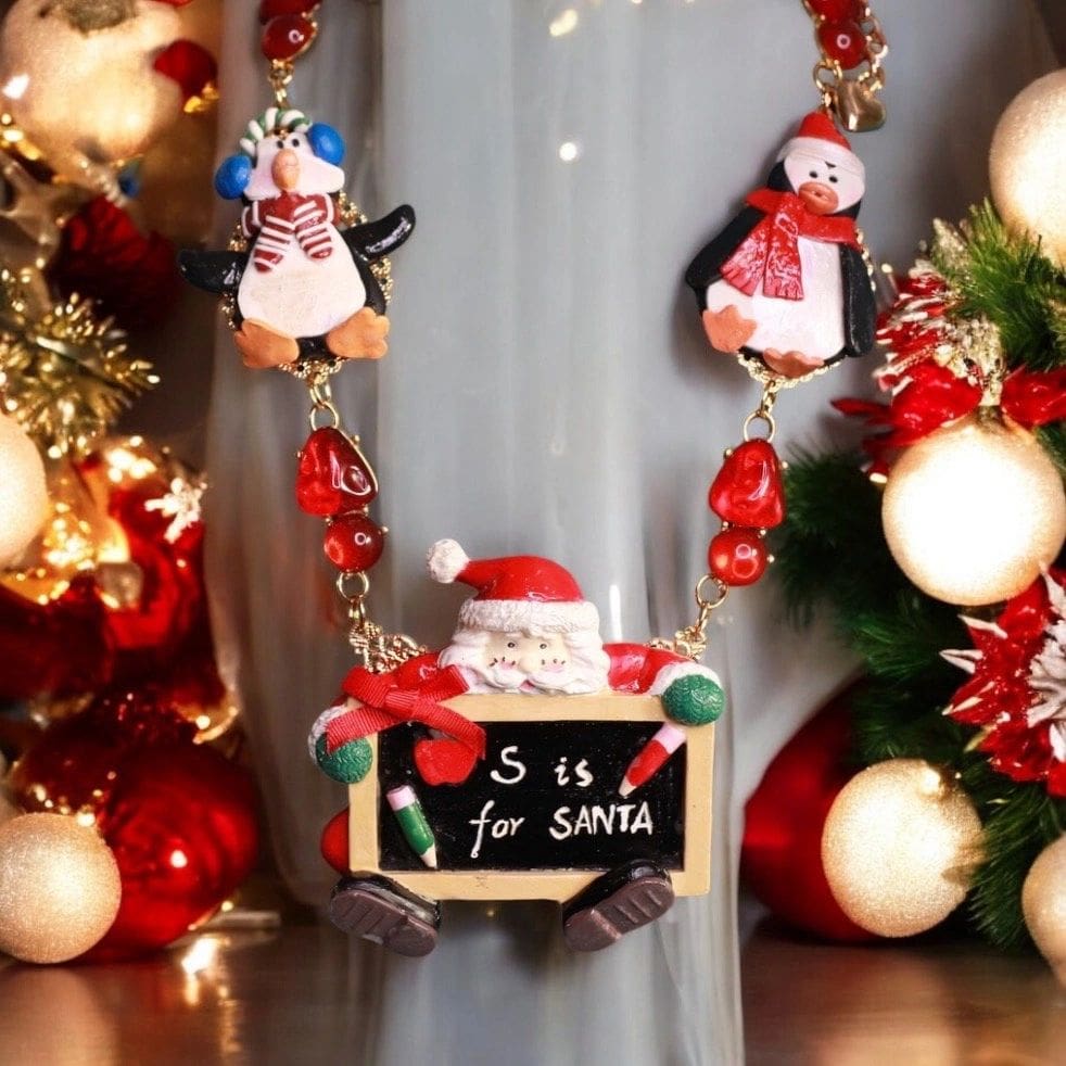 A necklace with santa and snowmen on it.