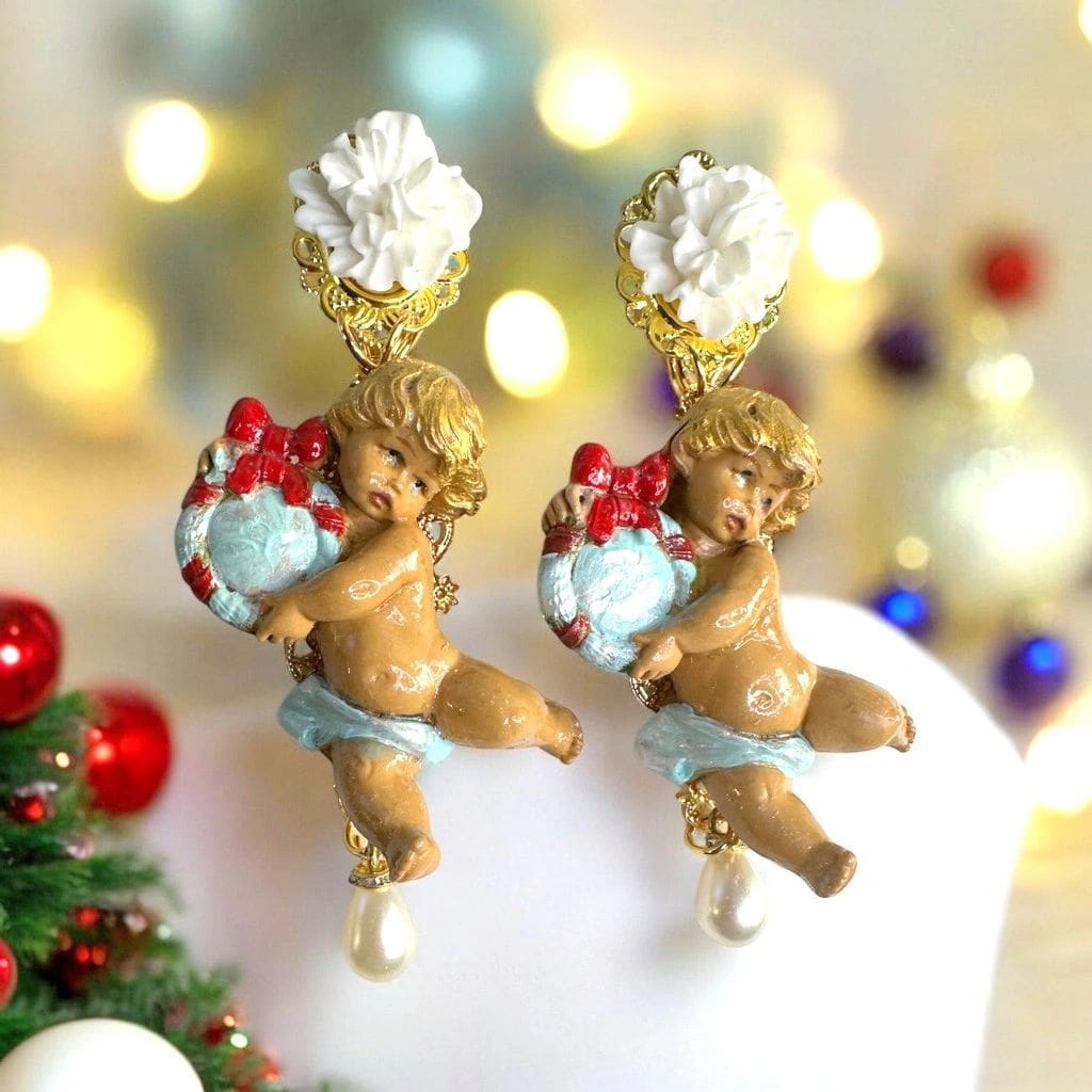 A pair of earrings that are on top of a cake.