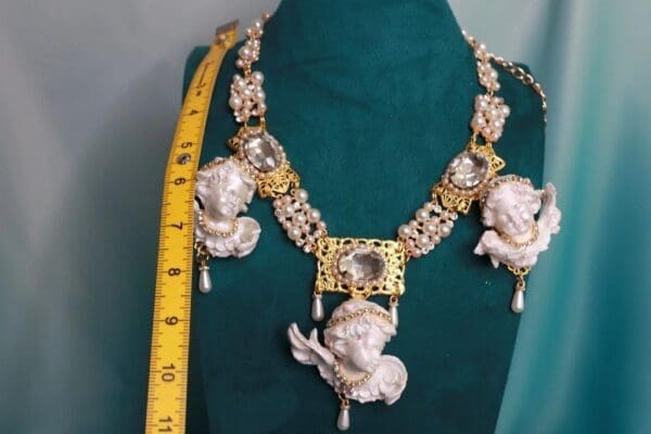 A necklace with a large chain and two small chains.